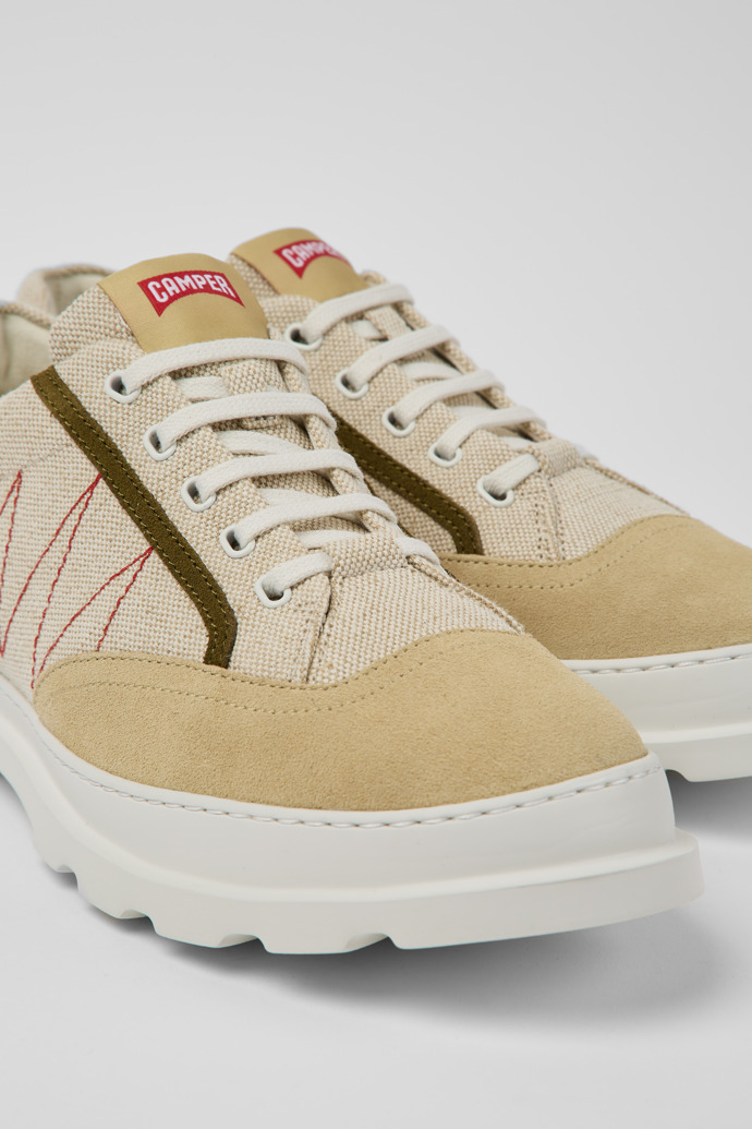 Close-up view of Brutus Beige and green sneakers for men