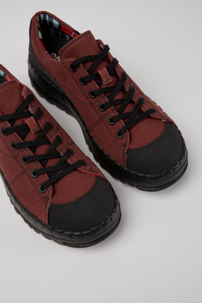 Close-up view of Teix Burgundy rubber and BCI cotton shoes