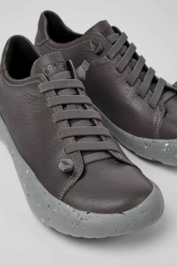 Close-up view of Peu Stadium Gray responsibly raised leather sneakers for men