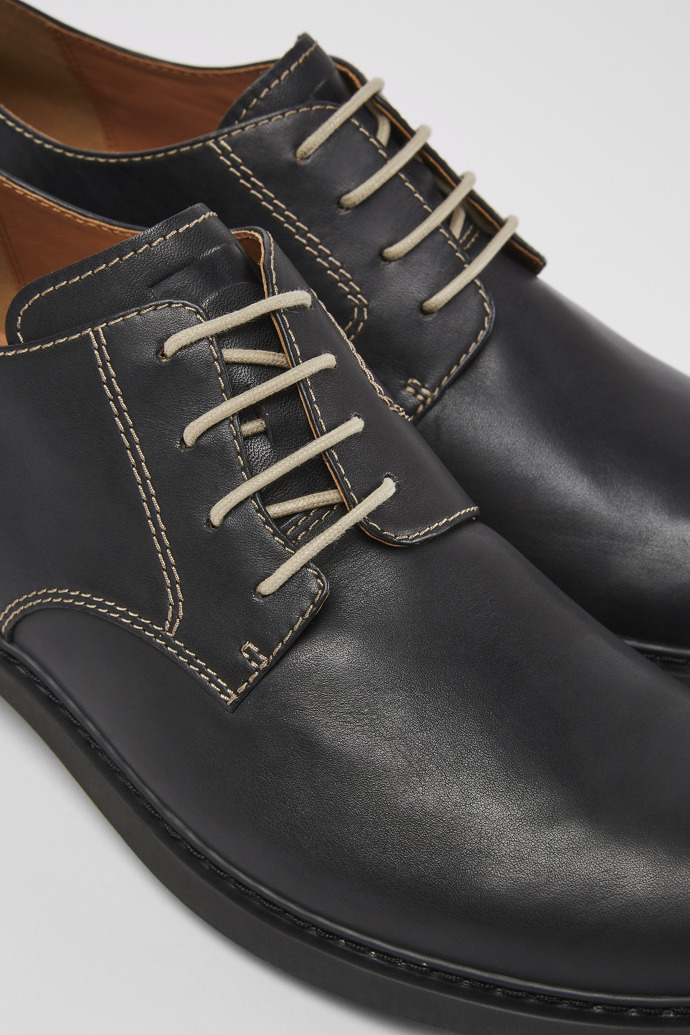 Close-up view of Twins Black leather lace-up shoes