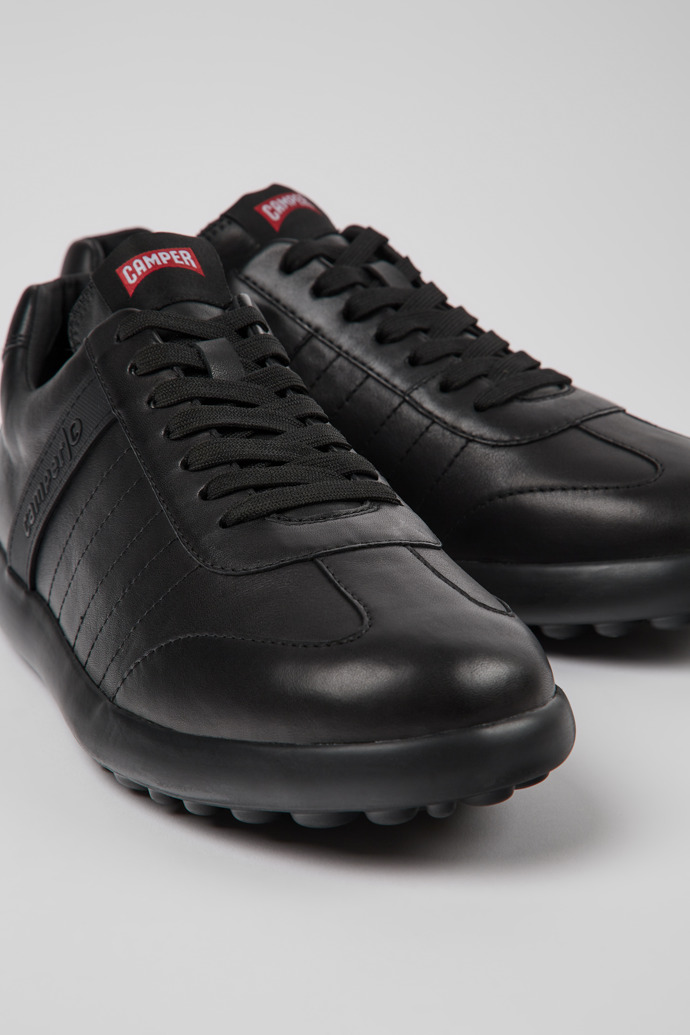 Close-up view of Pelotas XLite Black leather sneakers for men