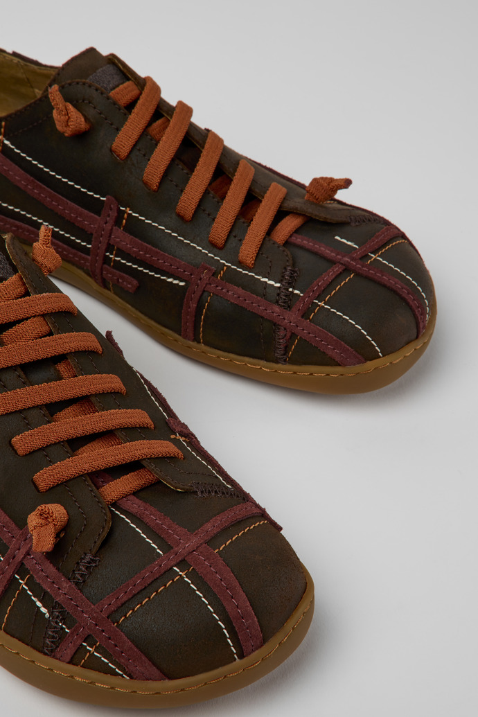 Close-up view of Twins Brown and red leather shoes