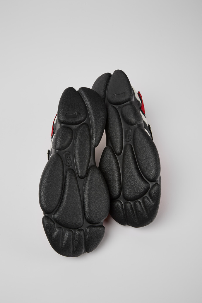 The soles of Karst White, black, and red textile shoes for men