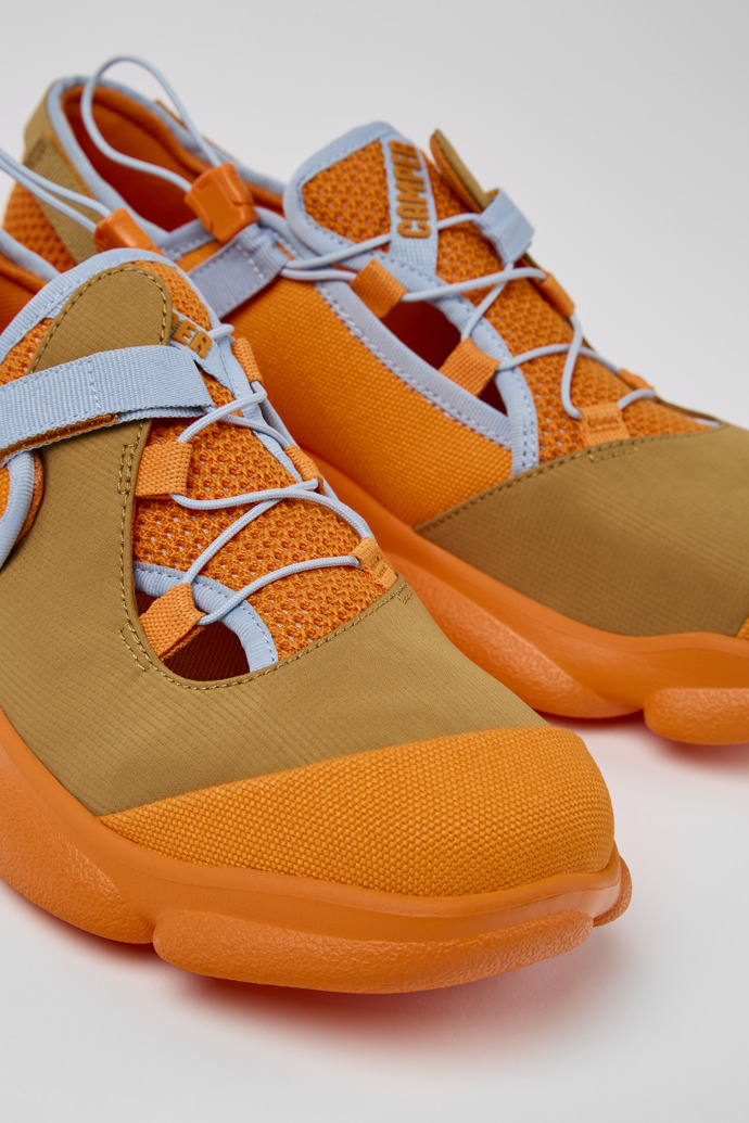 Close-up view of Karst Orange and brown textile shoes for men