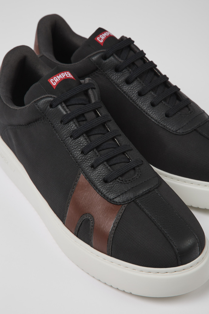 Close-up view of Runner K21 Black and red sneakers for men