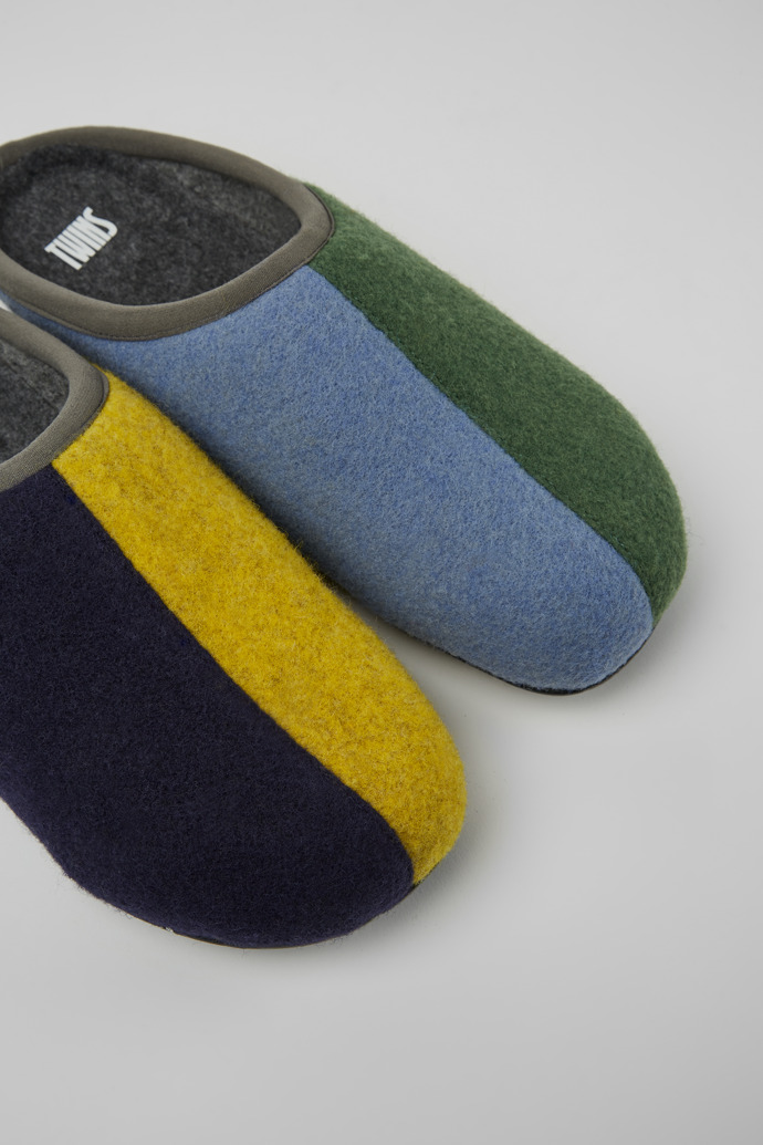 Close-up view of Twins Green, blue, and gray wool slippers for men