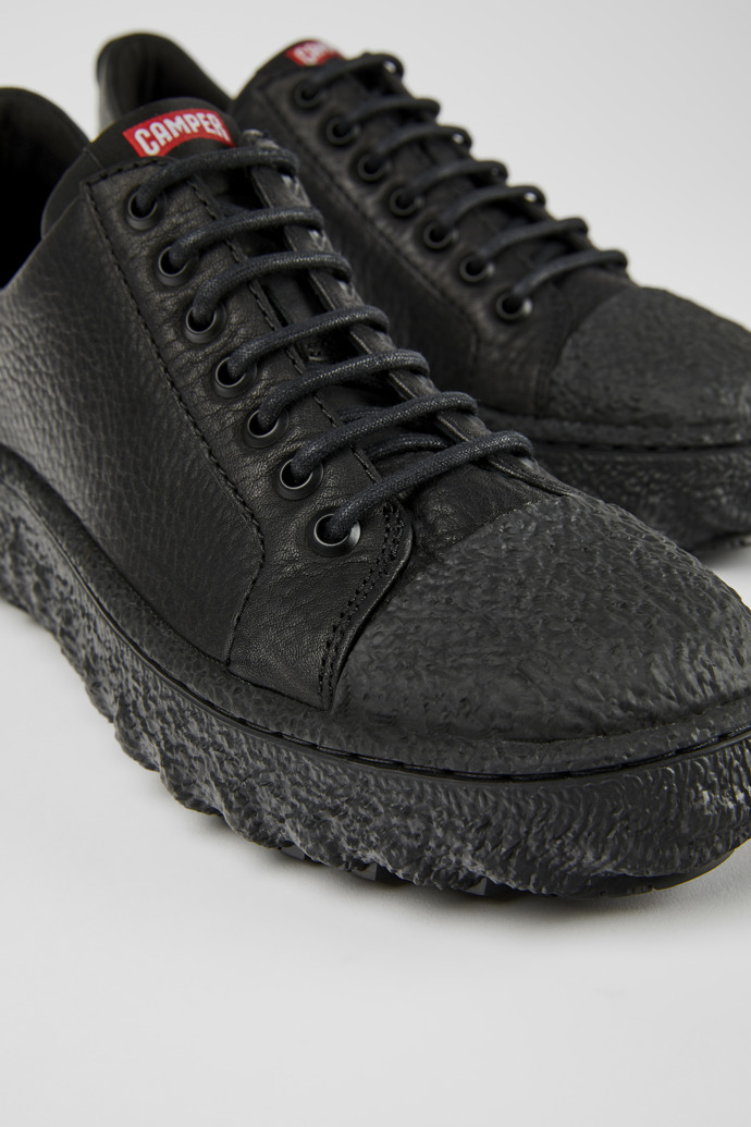 Close-up view of Ground Black leather shoes for men