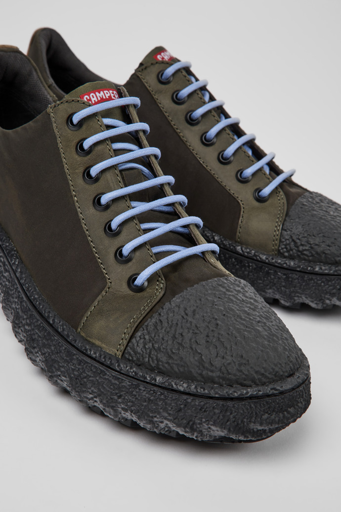Close-up view of Ground Green textile and nubuck shoes for men