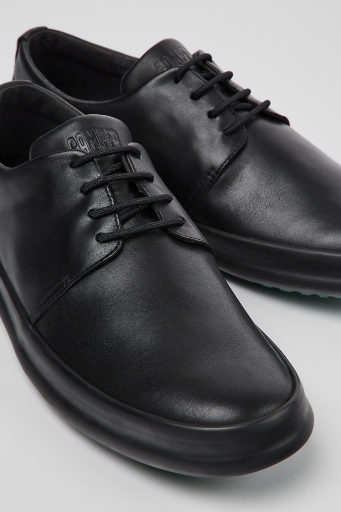 Close-up view of Chasis Black leather shoes for men