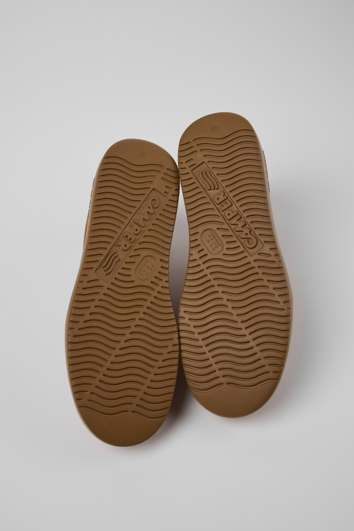 The soles of Runner K21 Brown Suede Sneakers for Men.