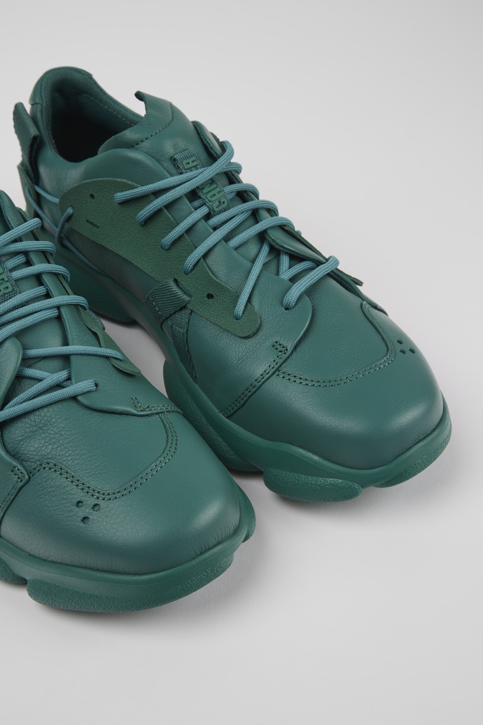 Close-up view of Karst Green leather and textile sneakers for men