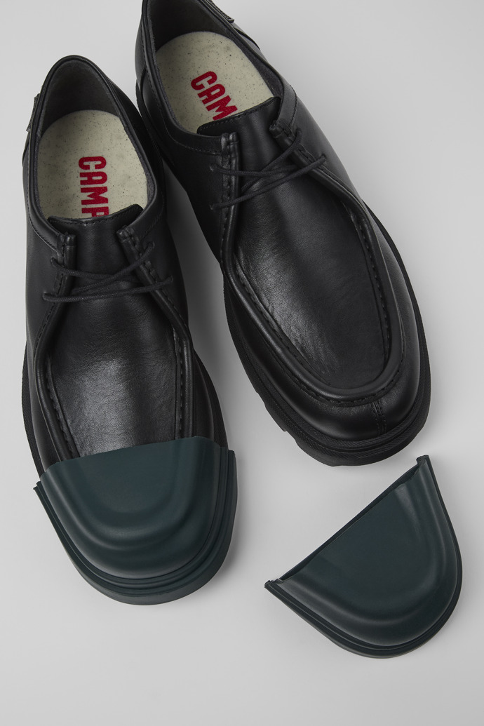 A model wearing Junction Black leather shoes for men