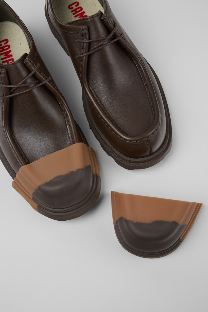 A model wearing Junction Brown Leather Men's Shoe.