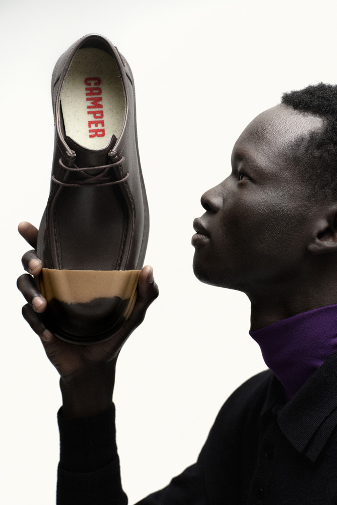 A model wearing Junction Brown Leather Men's Shoe.