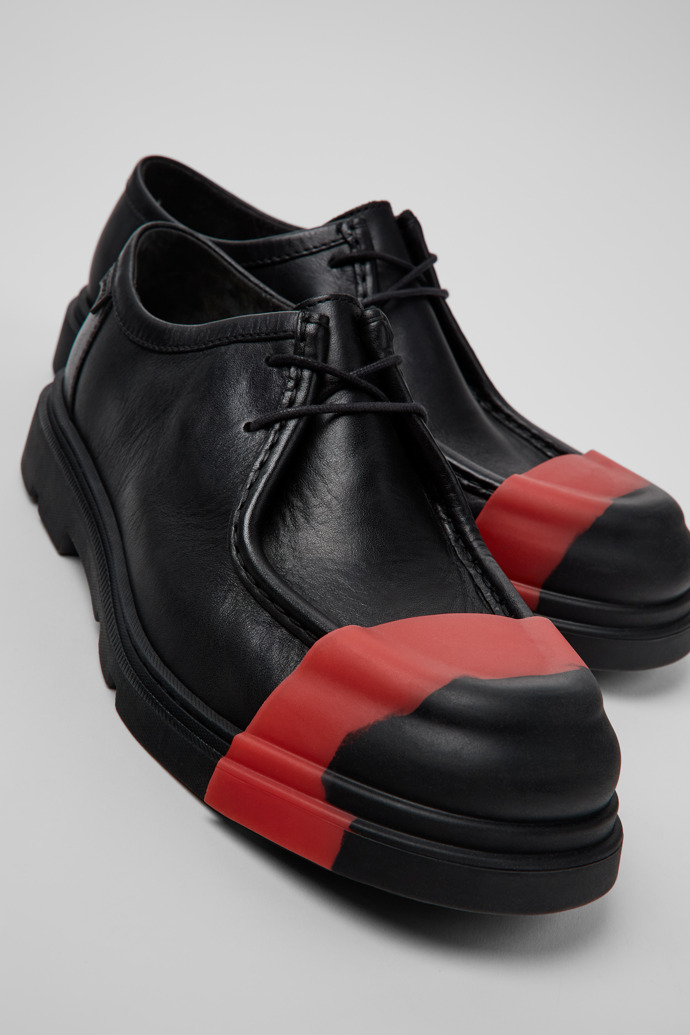 Close-up view of Junction Black Leather Shoes for Men.