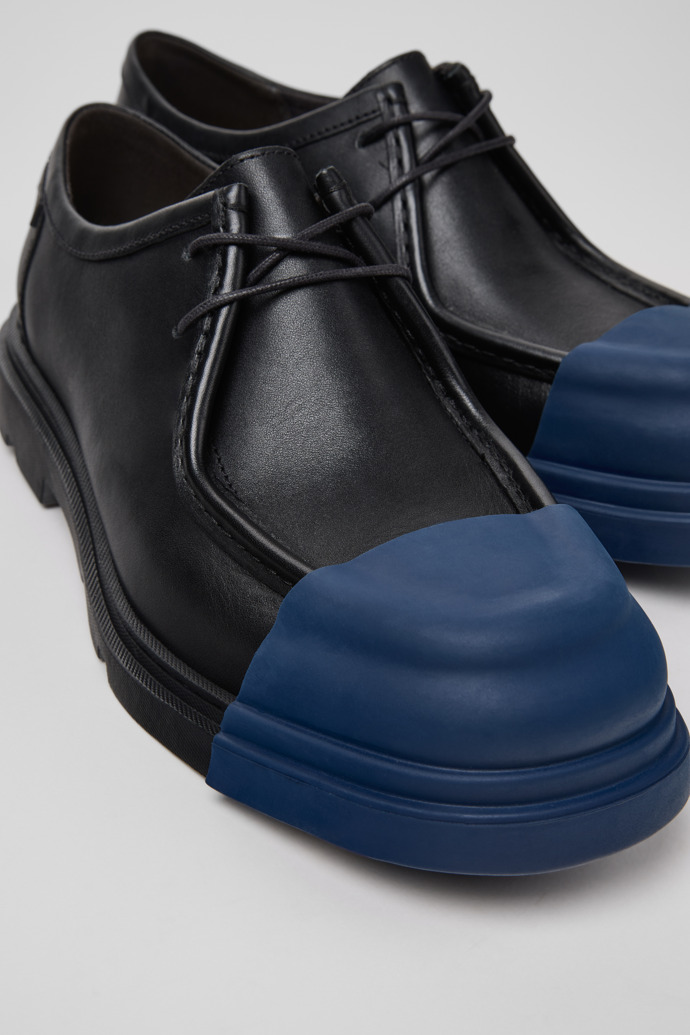 Close-up view of Junction Black Leather Shoes for Men.
