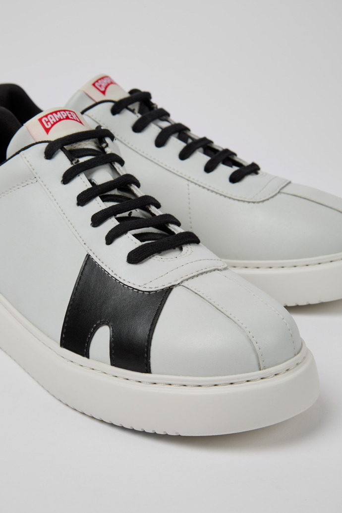 Close-up view of Runner K21 MIRUM® White and black sneakers for men