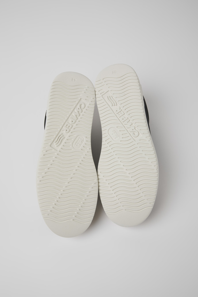The soles of Runner K21 MIRUM® Black and white sneakers for men