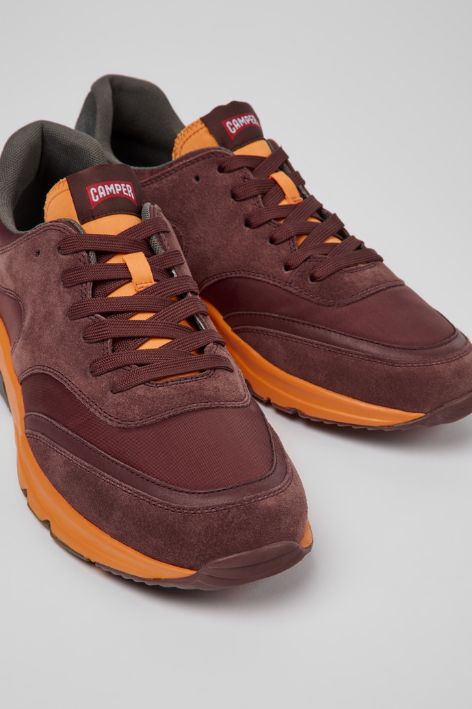 Close-up view of Drift Burgundy and orange textile sneakers for men