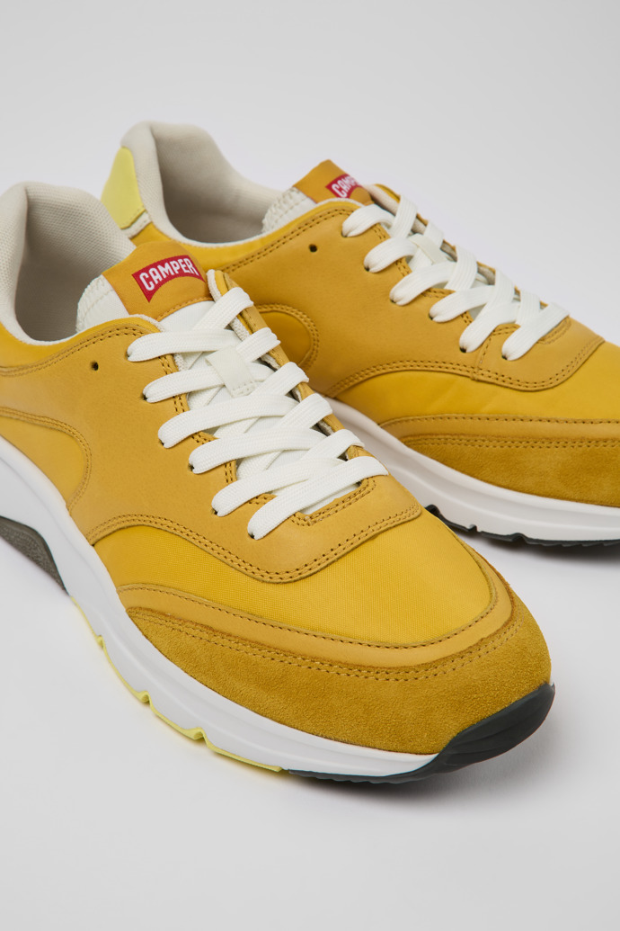 Close-up view of Drift Yellow textile and leather sneakers for men