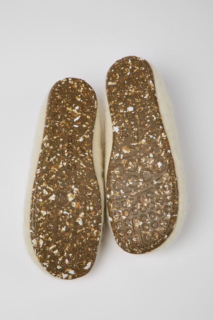 The soles of Wabi Beige wool slippers for men