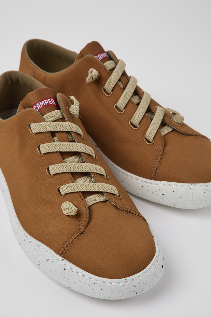 Close-up view of Peu Touring Brown textile sneakers for men
