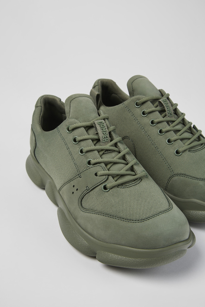 Close-up view of Karst Green leather and recycled PET sneakers for men