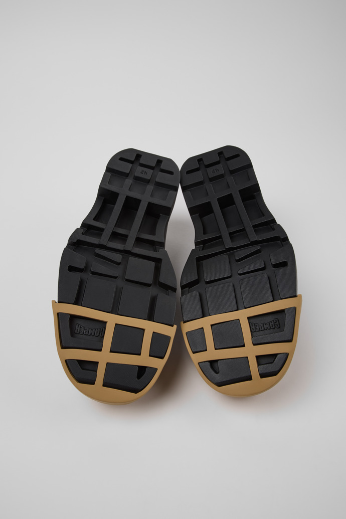 The soles of Junction Black Leather Moccasins and Nautical Shoes for Men.