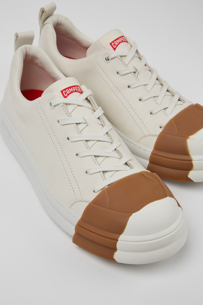 Close-up view of Junction Runner White Leather Men's Sneakers.