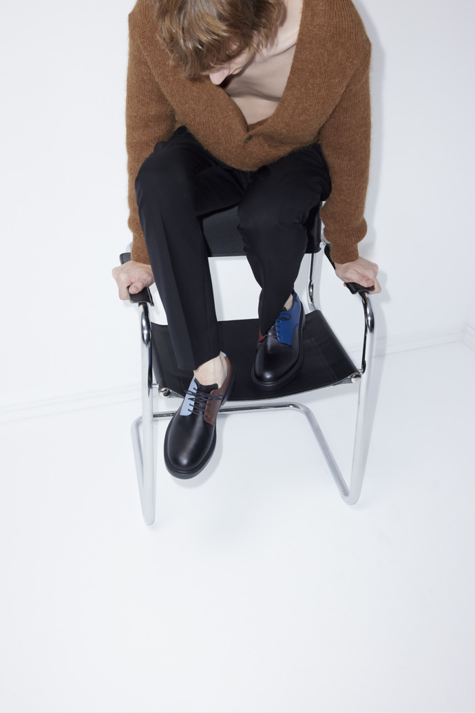 A model wearing Twins Multicolor Leather Shoes for Men.