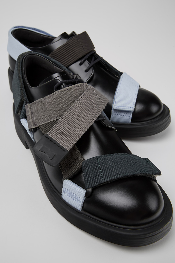 Close-up view of Twins Black leather and textile shoes for men