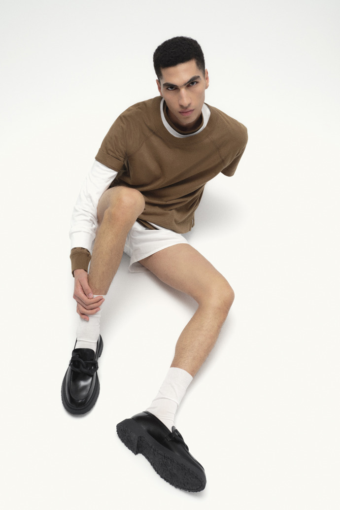 A model wearing Walden Black Leather Moccasin Shoes for Men.