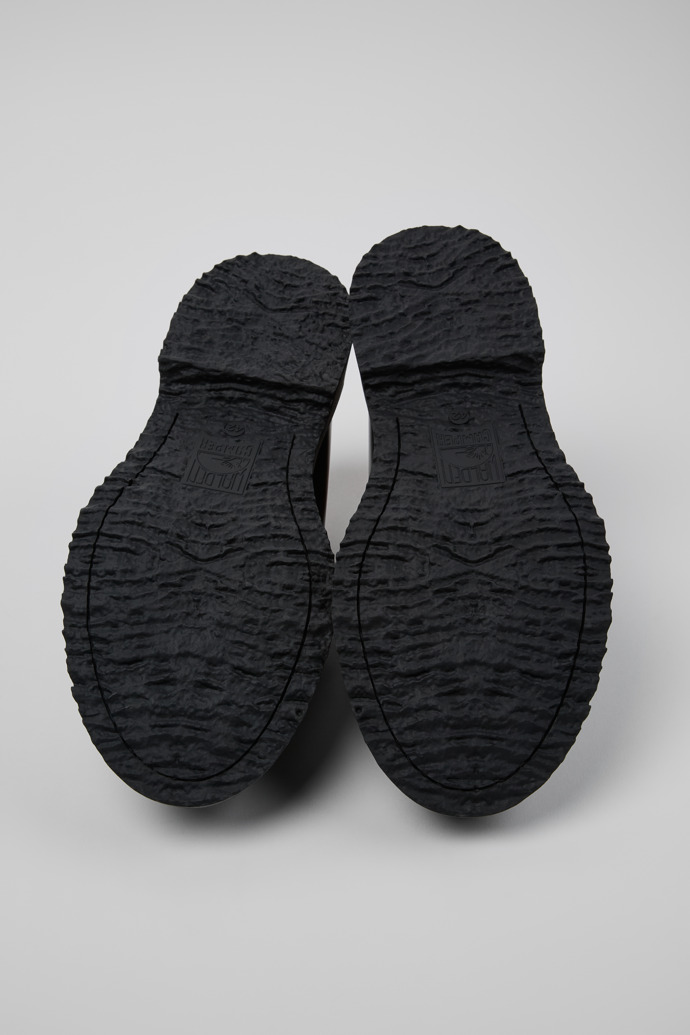 The soles of Walden Black Leather Moccasin Shoes for Men.