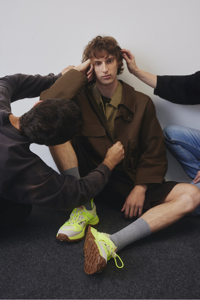 A model wearing Drift Trail VIBRAM Multicolor Recycled PET and Nubuck Sneakers for Men.