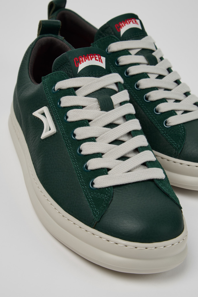 Close-up view of Runner Green Leather and Nubuck Sneakers for Men.