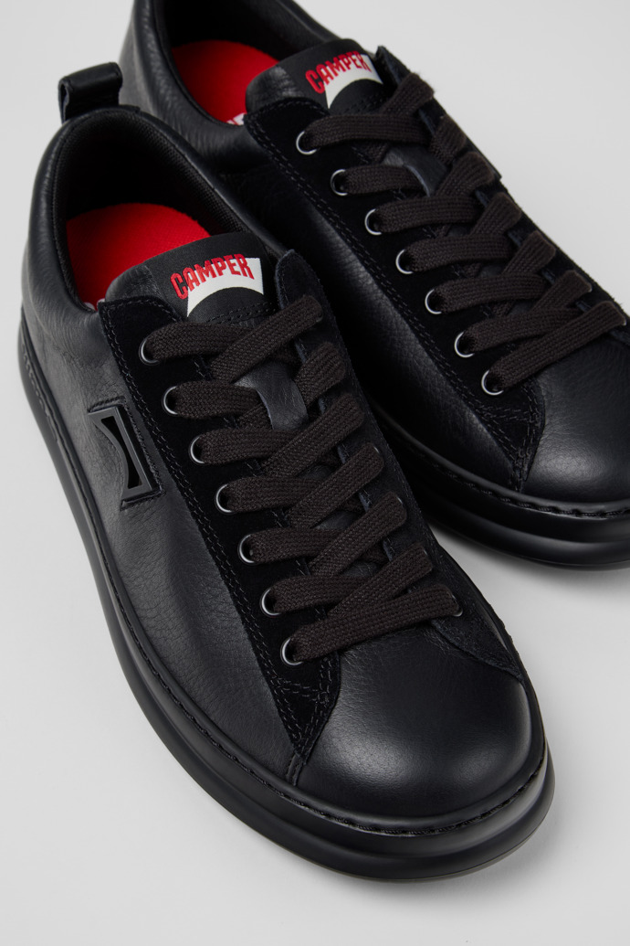 Close-up view of Runner Black Leather and Nubuck Sneakers for Men.
