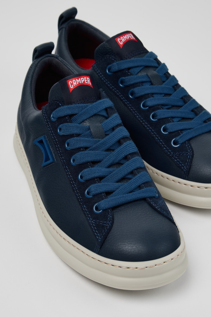 Close-up view of Runner Blue Leather and Nubuck Sneakers for Men.