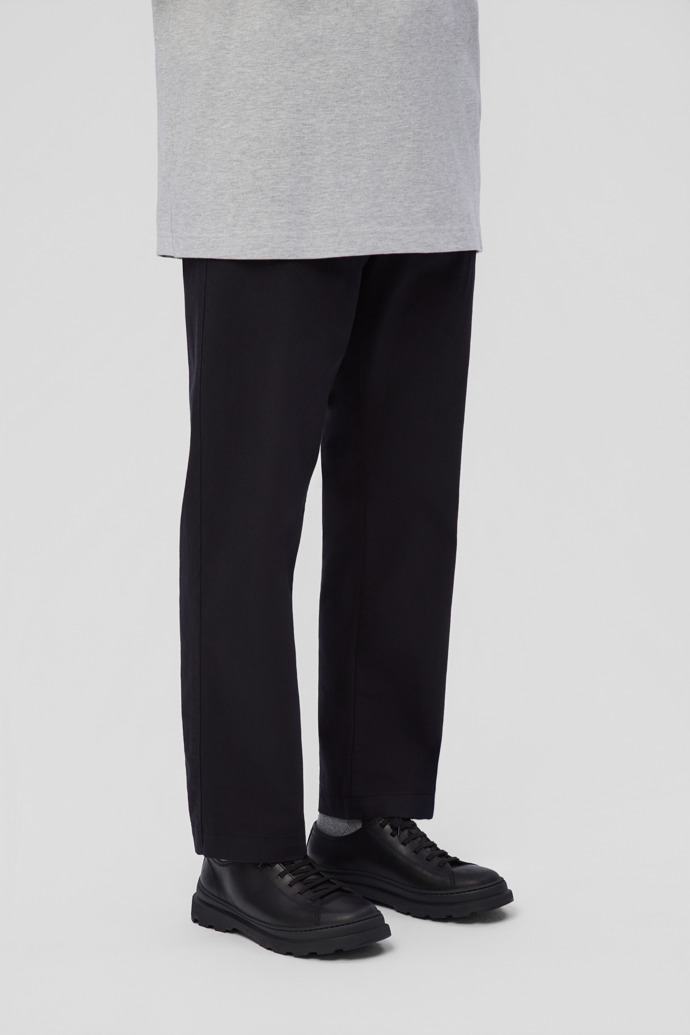 A model wearing Brutus+ Black Leather Shoes for Men.