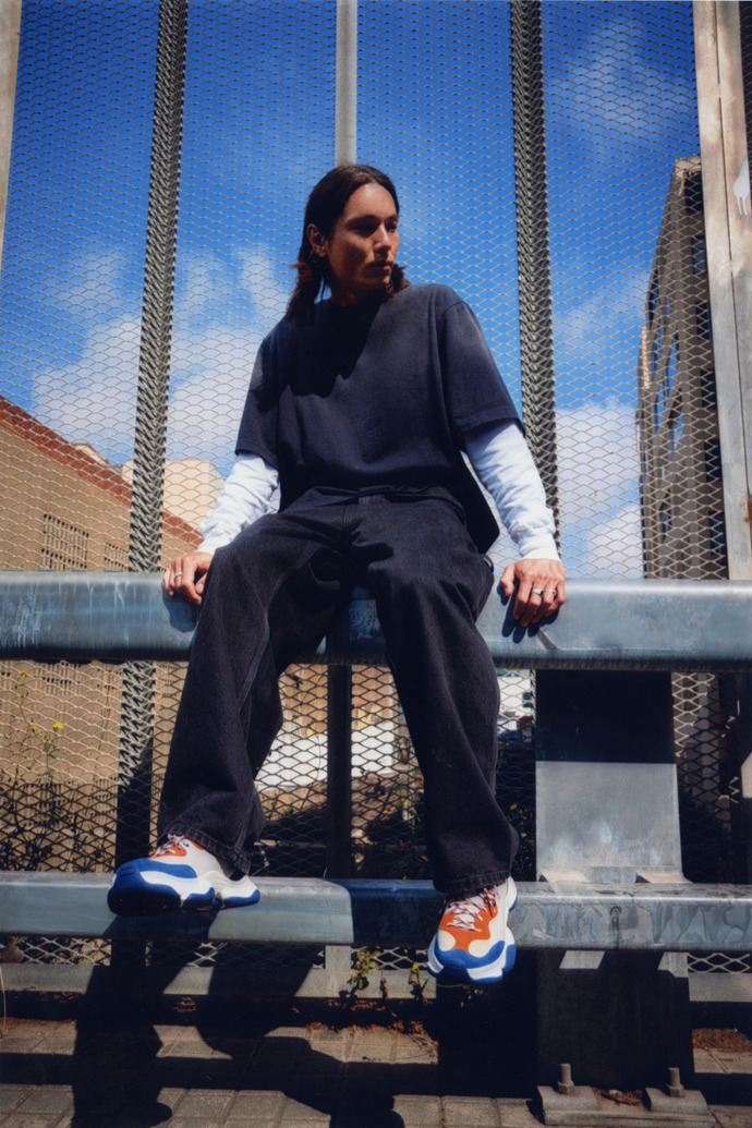 A model wearing Karst 2 Multicolor Leather and Nubuck Sneakers for Men.