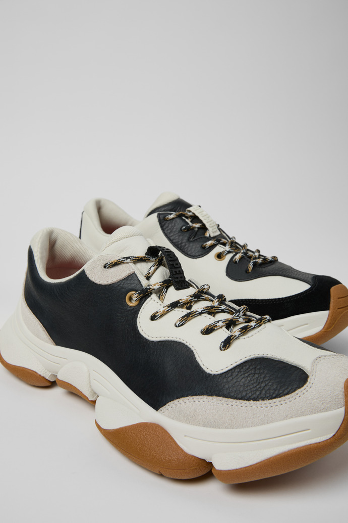 Close-up view of Twins White and Black Leather Sneakers for Men.