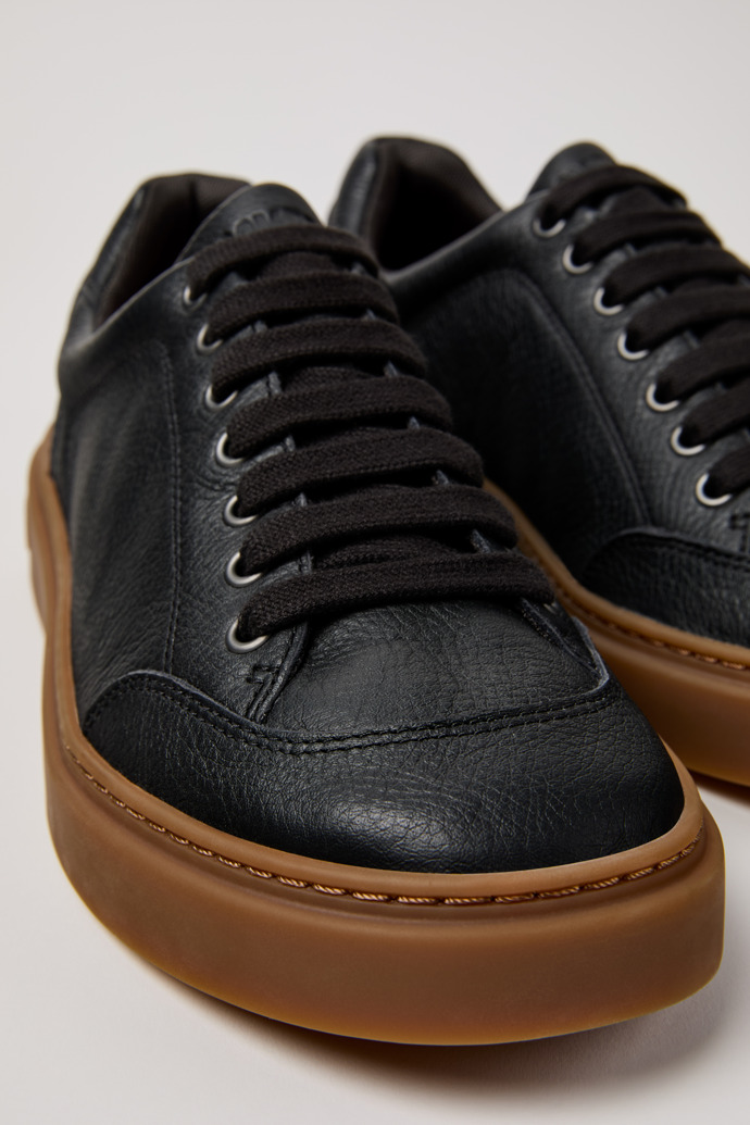 Close-up view of Runner Twentyfive Black Leather Sneakers for Men.