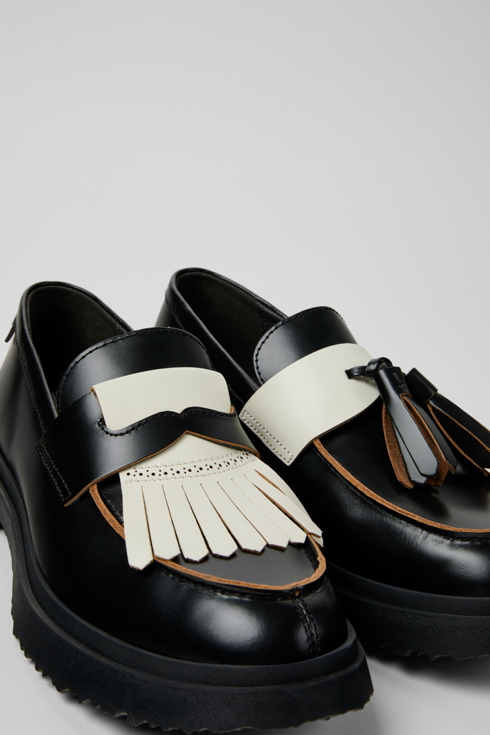 Close-up view of Twins Black and White Leather Nautical Shoes for Men.