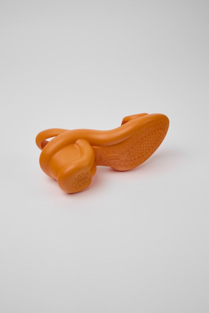 The soles of Kobarah Orange unisex sandals
