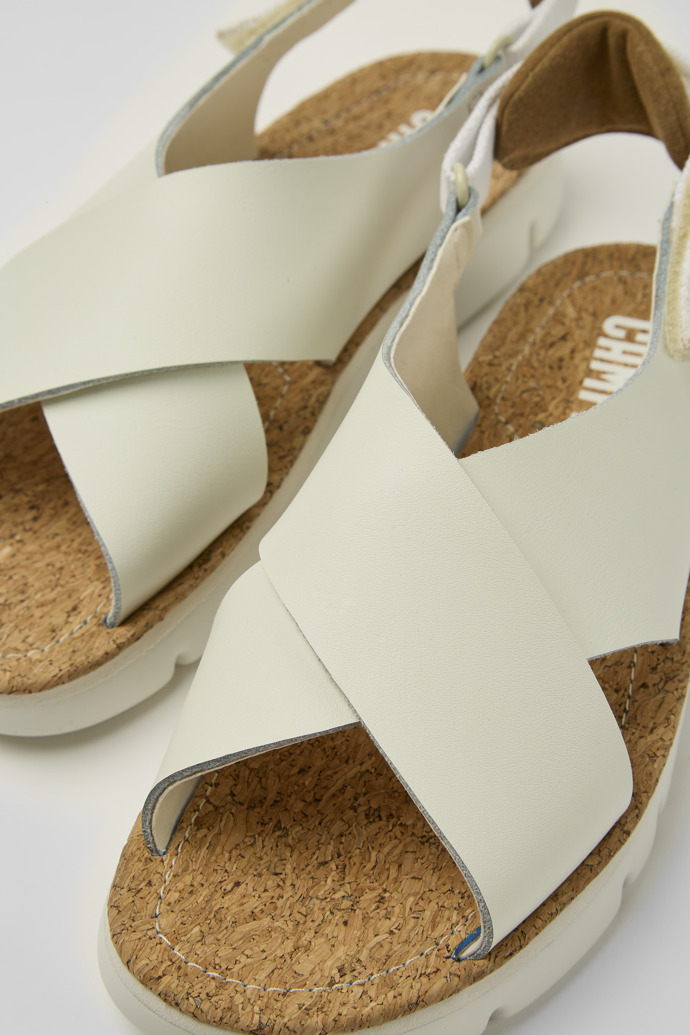 Close-up view of Oruga White leather and recycled PET sandals for women
