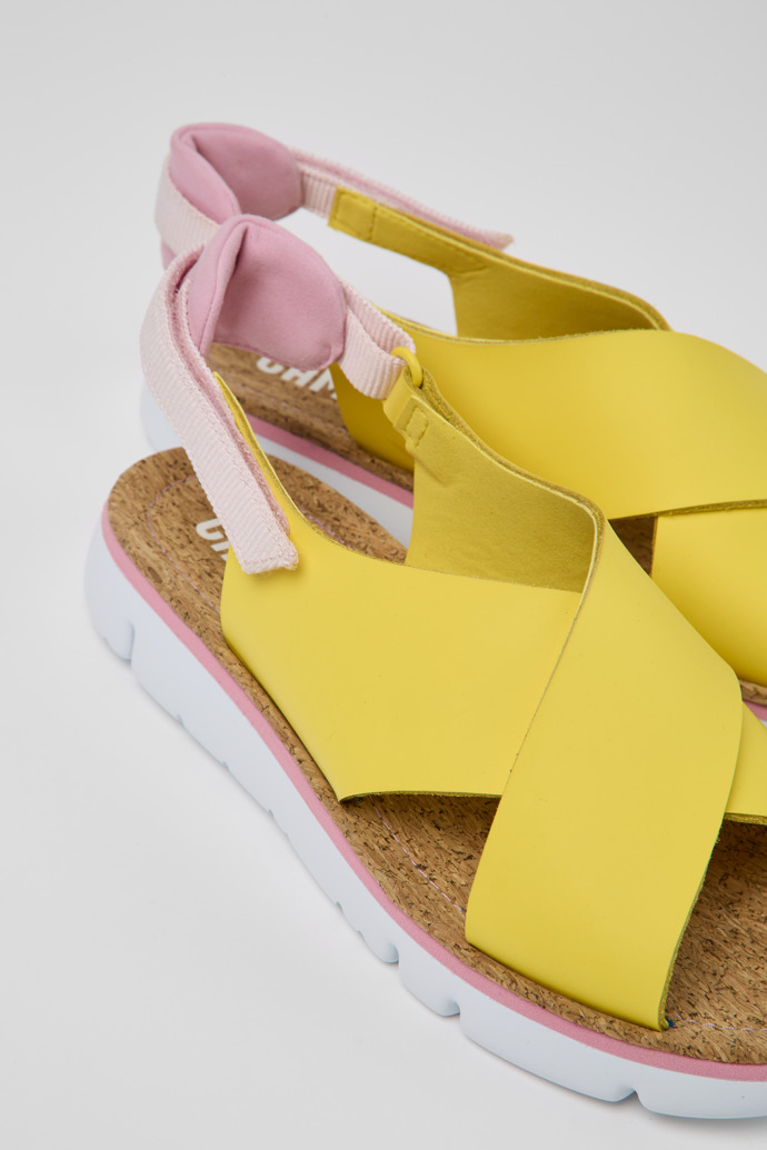 Close-up view of Oruga Yellow and pink sandals for women