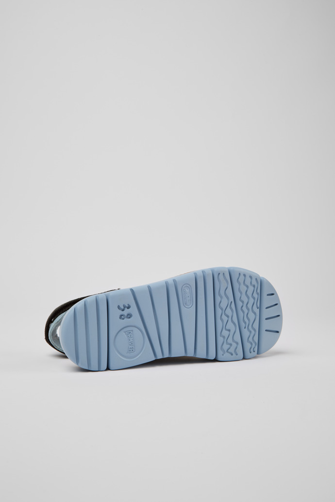 The soles of Oruga Green, blue, and grey sandals for women