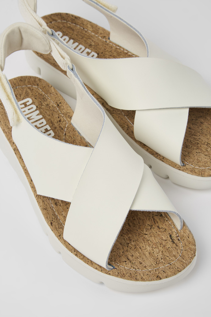 Close-up view of Oruga White leather and textile sandals for women