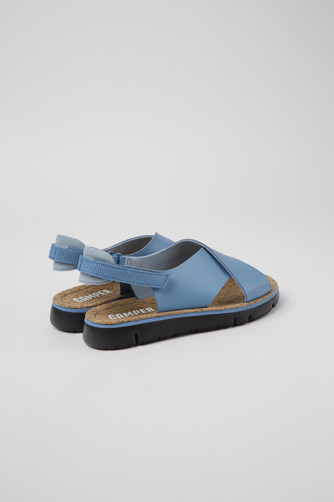 Back view of Oruga Blue leather and textile sandals for women