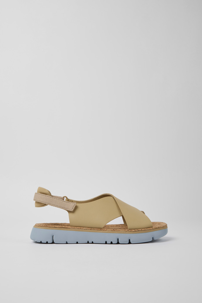 Side view of Oruga Beige leather and textile sandals for women