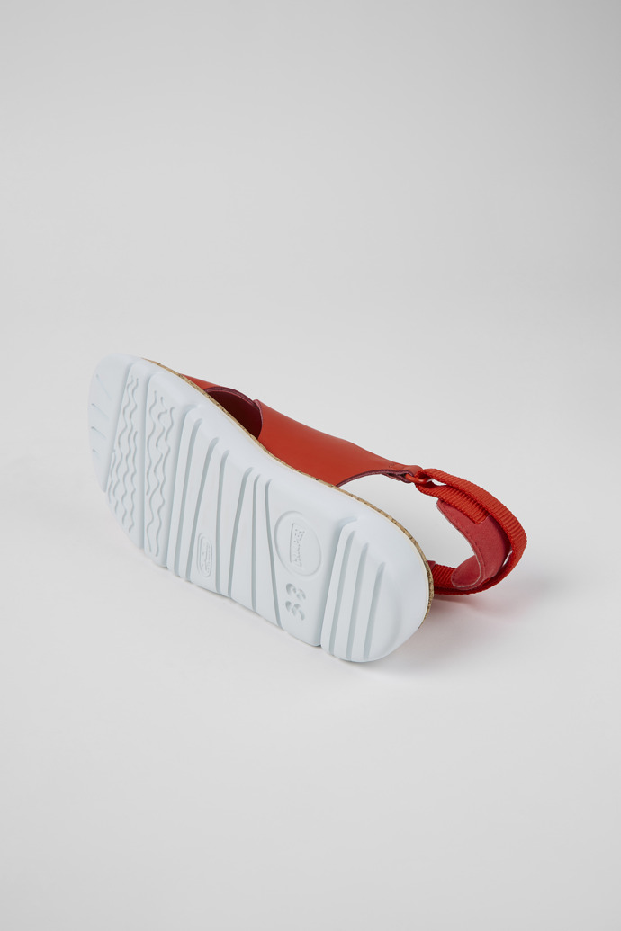 The soles of Oruga Red leather and textile sandals for women